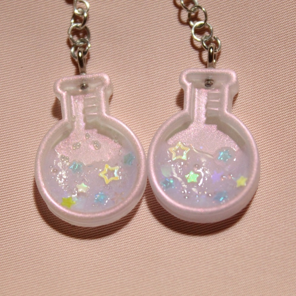 Magic potion dangle earrings
